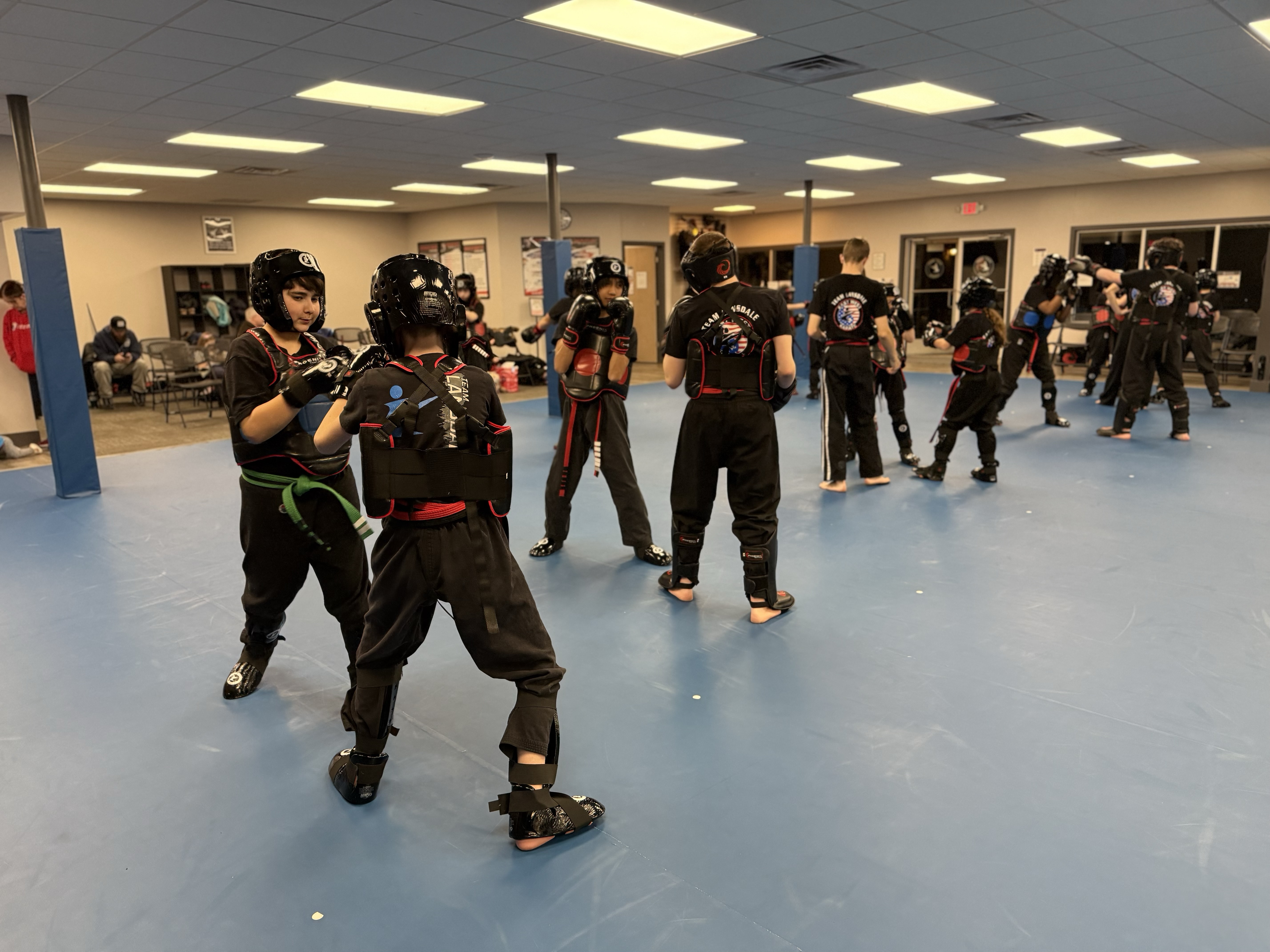 Sparring class in full gear at East West Karate