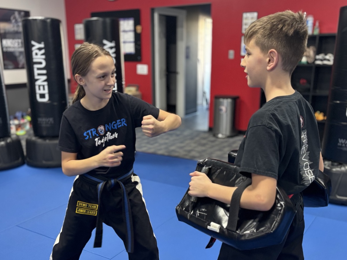 Two students practicing partner drills at East West Karate Trevose